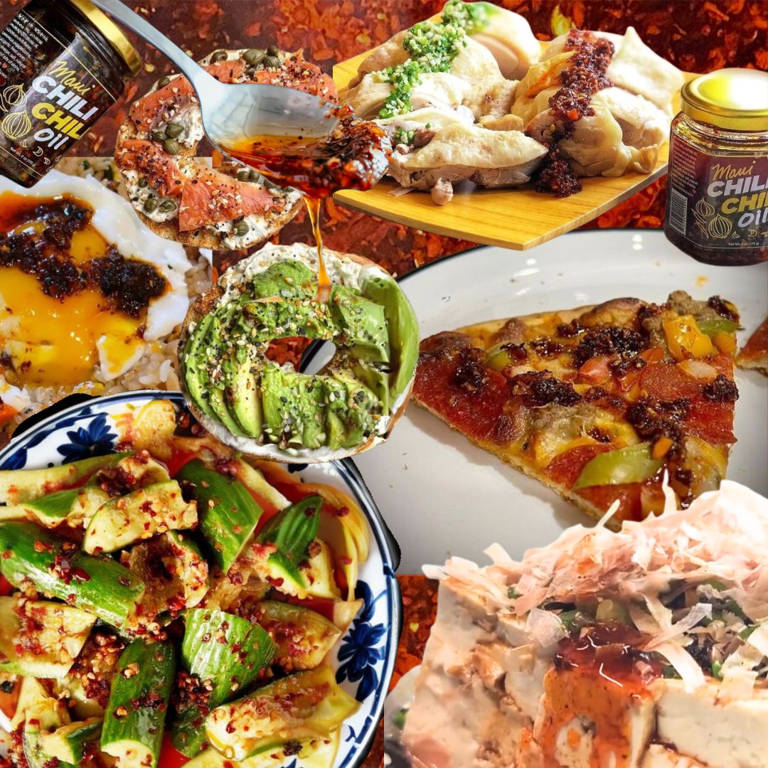 Assorted dishes including pizza, salad, and a bowl of guacamole with chili oil on a wooden table.