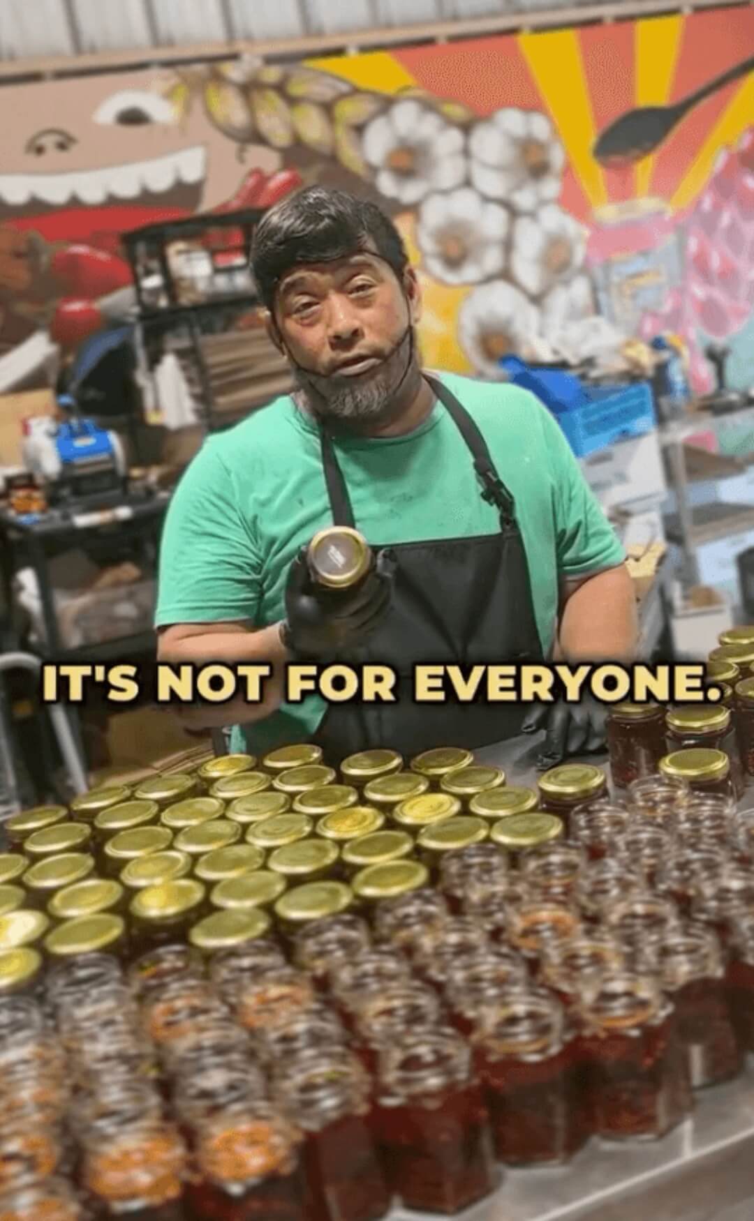 Deron holding a bottle with text 'IT'S NOT FOR EVERYONE' in a store setting.
